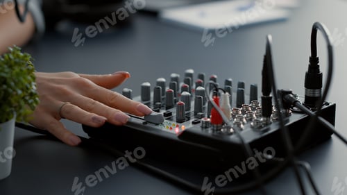 Preview: Woman Adjusting Sound Mixer in Music Studio