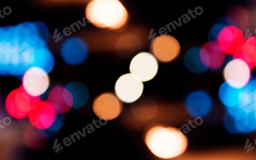 Preview: Blurred street bokeh lights at night time