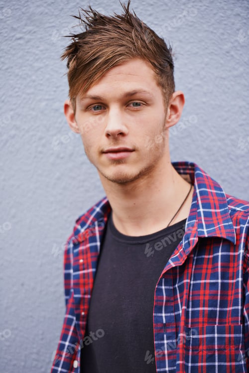 Preview: Hes got style. Portrait of a trendy young man standing outside.