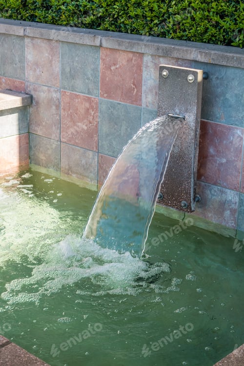 Preview: A View Of A Fountain With Colorful Tiles.