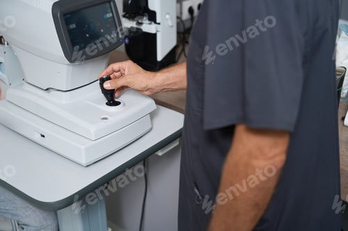 Preview: Male doctor working at the ophthalmic hospital
