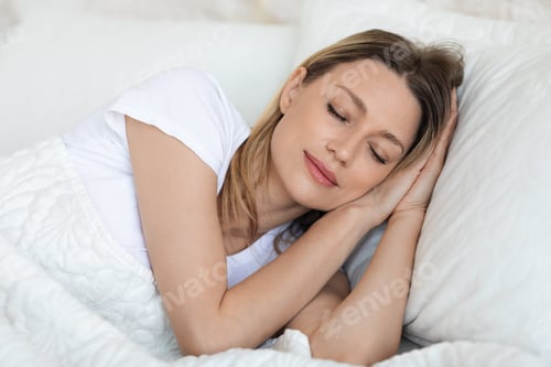 Preview: Closeup of pretty young woman sleeping in bed
