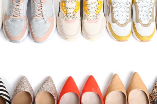 Preview: Frame of different shoes on white background, top view with space for text