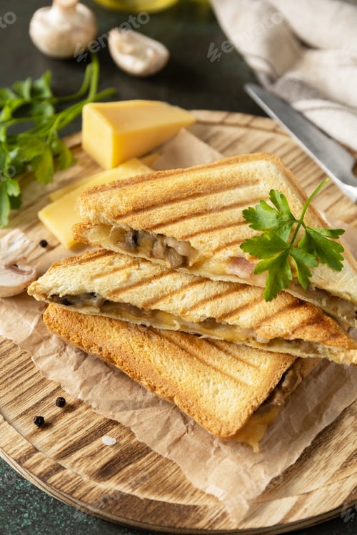Preview: Delicious sandwich with grilled cheese, bacon and mushroom.
