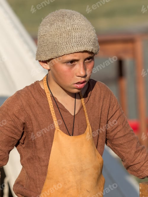 Preview: assistant blacksmith. Portrait of a young guy in a folk costume