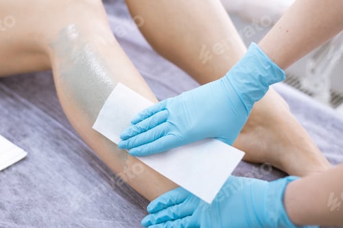 Preview: female legs hair removal with wax in beauty salon
