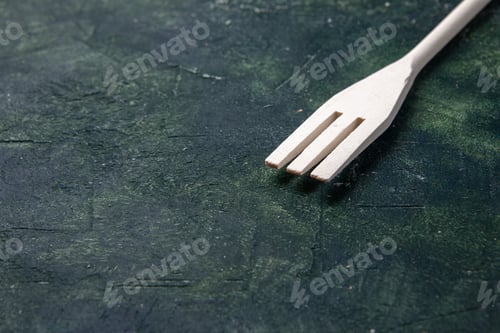 Preview: front view white plastic fork on dark background plastic fork cutlery wood color darkness knife