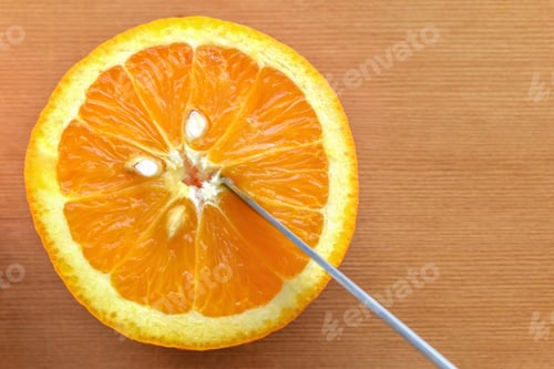 Preview: Orange fruit on a bamboo cutting board.