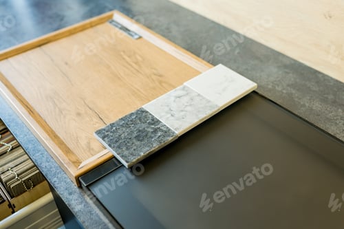 Preview: Designer woman choosing details of new kitchen in a home improvement store