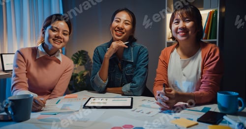 Preview: Millennial Asia people meeting brainstorming ideas about new paperwork project.