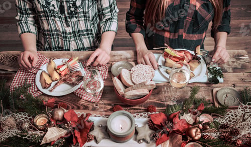 Preview: Flat-lay of friends hands eating and drinking together.