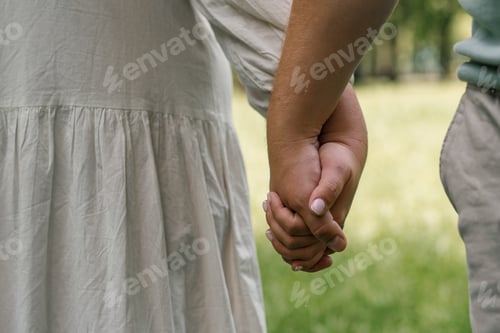 Preview: hands of couple in love close-up couple holding hands concept of support care love happy family