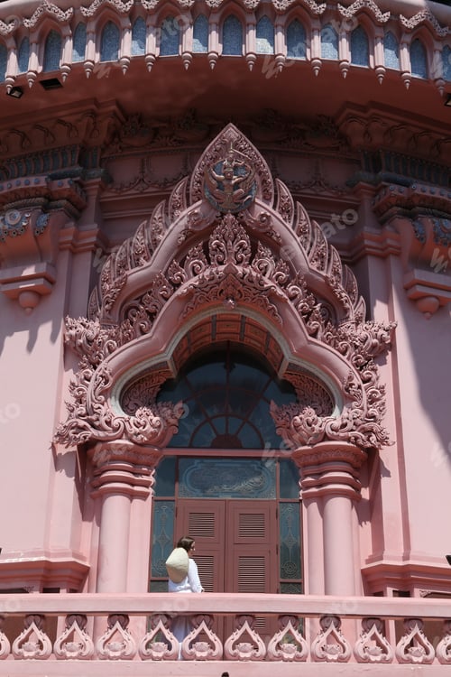 Preview: Erawan Museum In Bangkok City, Thailand, And Tourist Girl In Asian Hat. Pink Windows Of Erawan