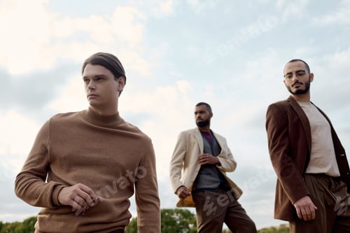 Preview: Handsome men showcase stylish autumn attire against a picturesque field backdrop