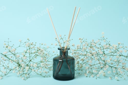 Preview: Aroma scent diffuser and flowers on blue background