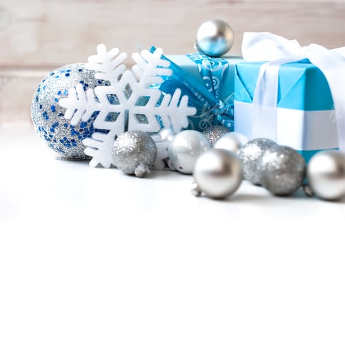 Preview: silver Christmas balls and gifts on wooden table