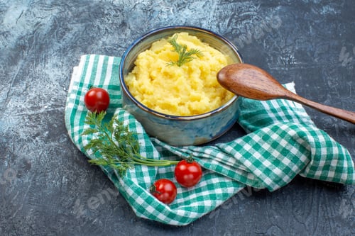 Preview: Front view of mashed potatoes served with dill wooden spoon fresh tomatoes on green stripped towel