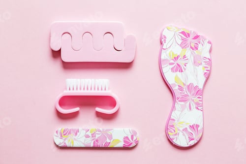 Preview: Set for pedicure lying on pink background beauty manicure nails spa relax care polish gel acrylic