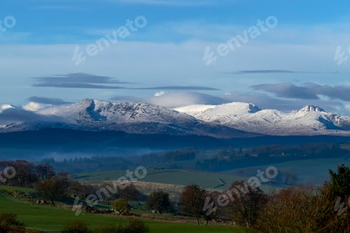 Preview: Scenic landscape with distant snow capped mountains, Llanberis, Gwynedd, Wales