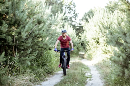 Preview: Man riding bicycle on the forest road