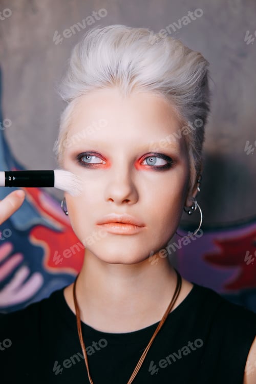 Preview: Portrait of a young fashionable blonde girl with an original hai