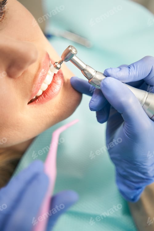 Preview: Woman having dental procedure in stomatology clinic