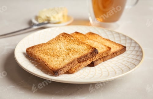Preview: Plate with toasted bread on table