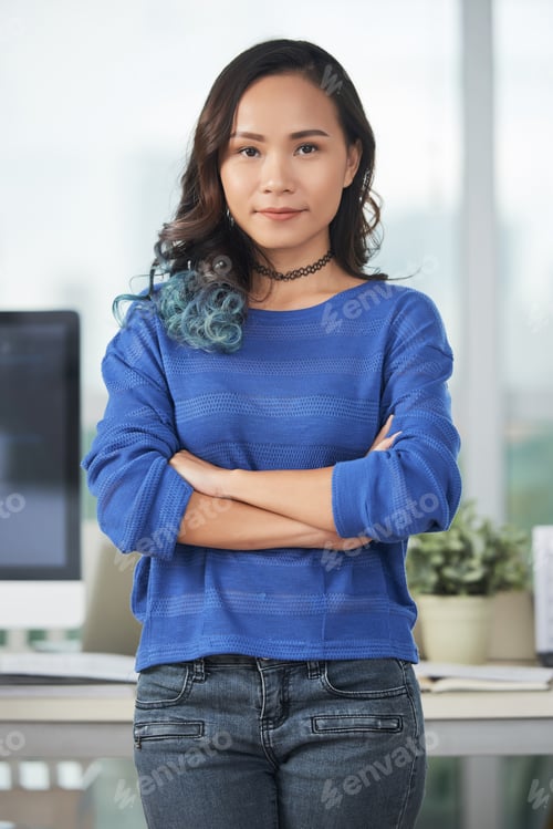 Preview: Confident Asian woman in office