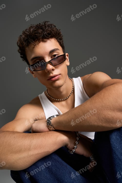 Preview: Stylish teenager showcases Gen Z fashion with curly hair and trendy sunglasses