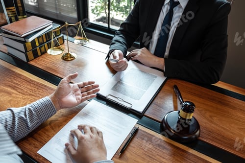 Preview: Professional male lawyer or counselor discussing negotiation legal case with client meeting with