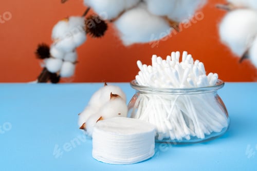 Preview: Set of cotton buds sticks on blue paper
