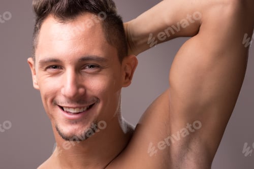 Preview: One Young Adult Man Smiling Face Head Closeup, Arm Raised Up