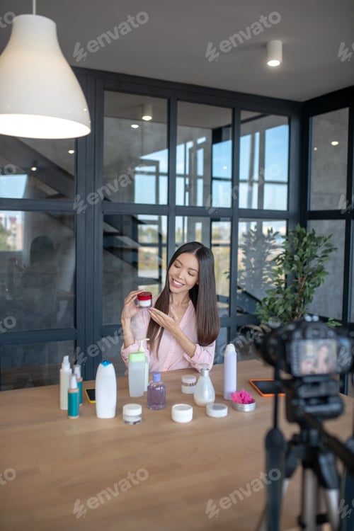 Preview: Woman Showcasing Beauty Products for Online Video Blog