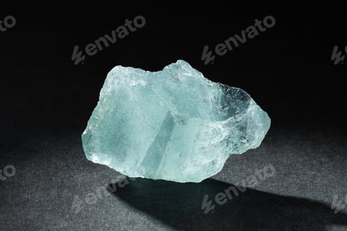 Preview: Rough Uncut Pale Blue Aquamarine Gemstone on Black