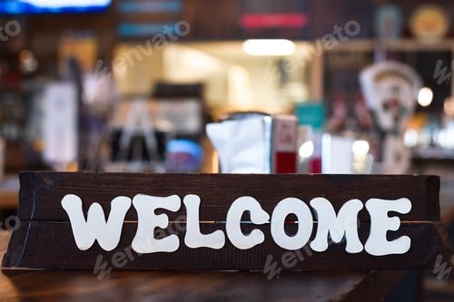 Preview: Wooden welcome sign in a restaurant or diner
