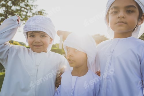 Preview: children playing together in Dubai in the park.