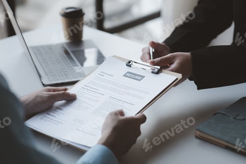 Preview: A person attends a job interview with a manager to join a company, he holds a resume and interview w