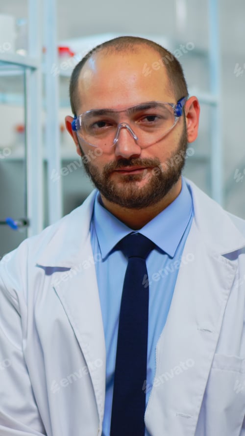 Preview: Portrait of exhausted chemist looking at camera