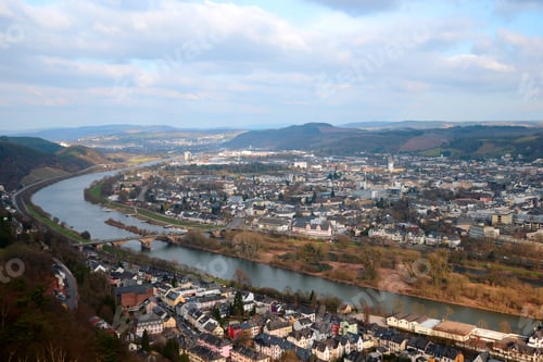 Preview: Aerial view of a long river among the city with mountains on a background in Trier, Germany