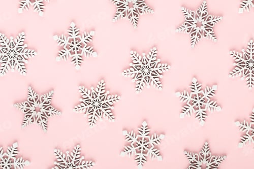 Preview: Christmas background. White snow decorations on a pink background.