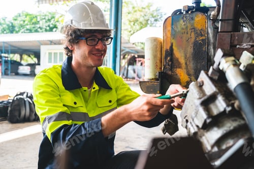 Preview: professional business industry technician wearing safety helmet working to maintenance service