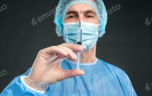 Preview: Medical Professional Holds Syringe in Clinical Setting