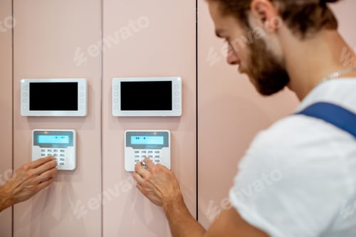 Preview: Man setting up the home alarm
