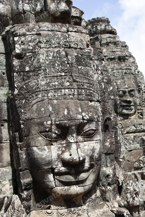 Preview: A beautiful face at the Bayan temple in Angkor Wat in black stone