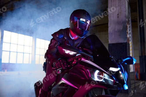 Preview: Portrait of motor biker driving sport motorcycle in neon light