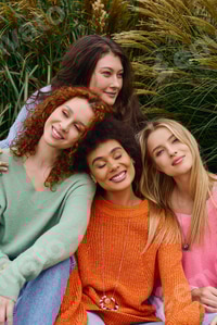 Preview: Confident trendsetters enjoying a sunny spring outing in a vibrant park setting