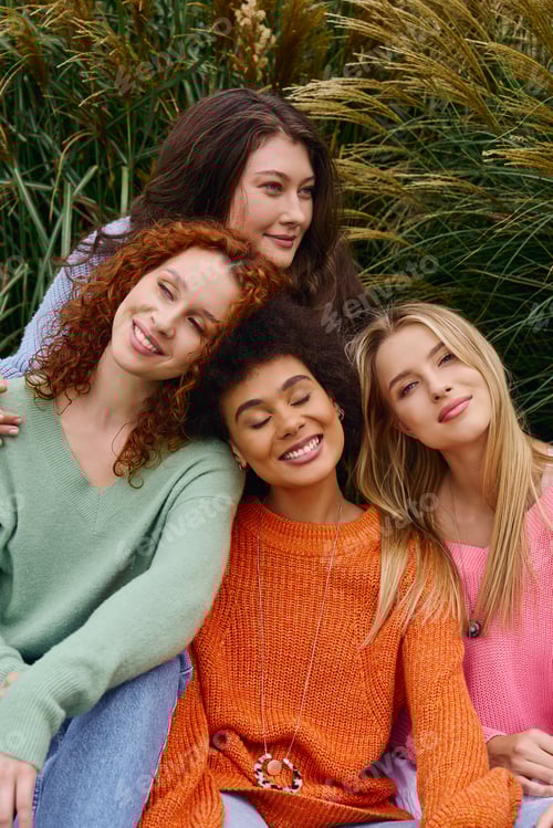 Preview: Confident trendsetters enjoying a sunny spring outing in a vibrant park setting