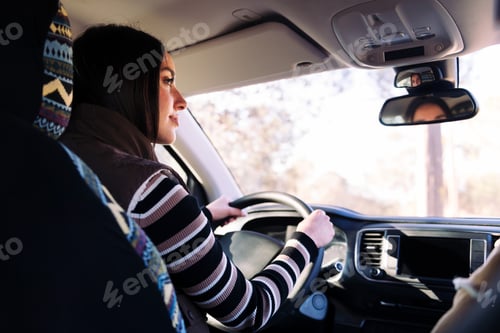 Preview: young woman driving camper van to new horizons
