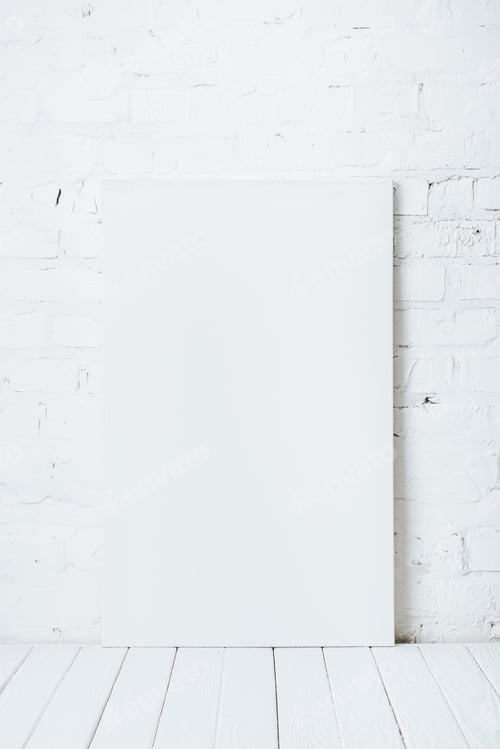 Preview: blank placard on white wooden table near brick wall