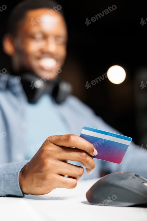 Preview: African american person enters credit card details